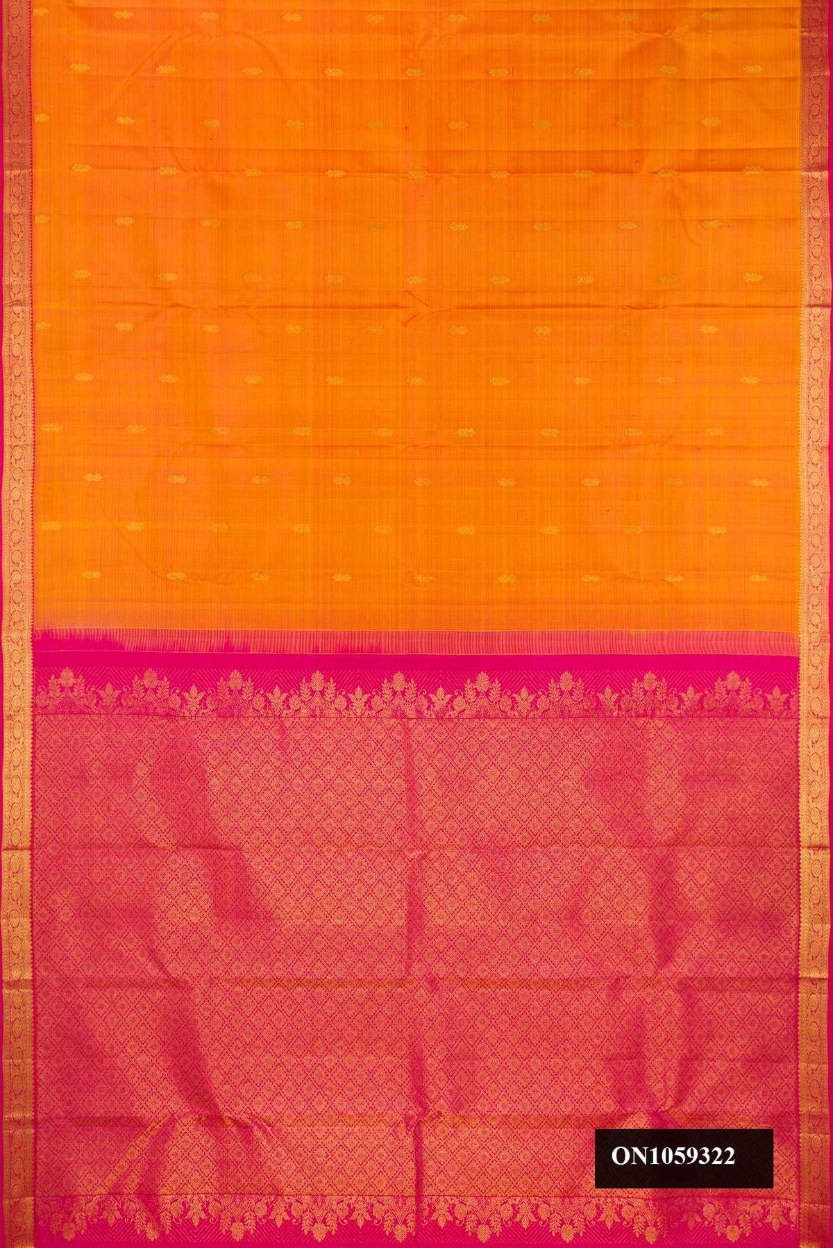 Mustard Dual Tone Kanchipuram Silk Saree with Zari Butta on the body and Zari Border.  displayed on a mannequin