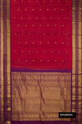 Maroon Dual Tone Kanchipuram Silk Saree with Zari Butta on the body and Zari Border.  displayed on a mannequin
