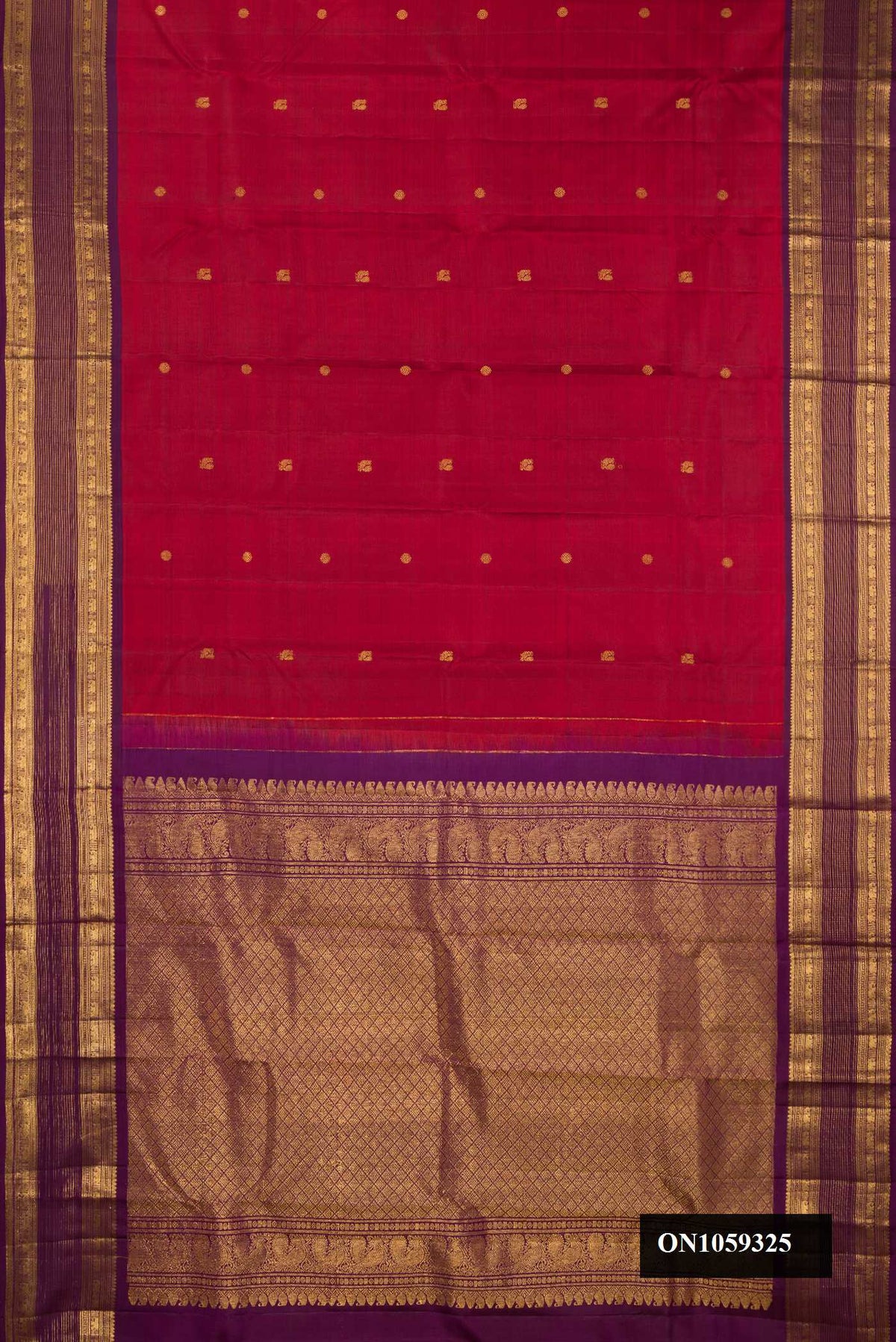 Maroon Dual Tone Kanchipuram Silk Saree with Zari Butta on the body and Zari Border.  displayed on a mannequin