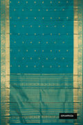 Green Dual Tone Kanchipuram Silk Saree with Zari Butta on the body and Zari Border.  displayed on a mannequin