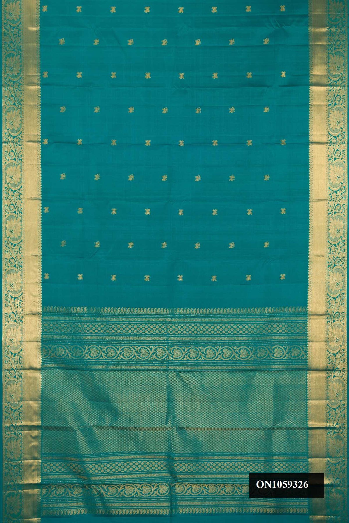 Green Dual Tone Kanchipuram Silk Saree with Zari Butta on the body and Zari Border.  displayed on a mannequin