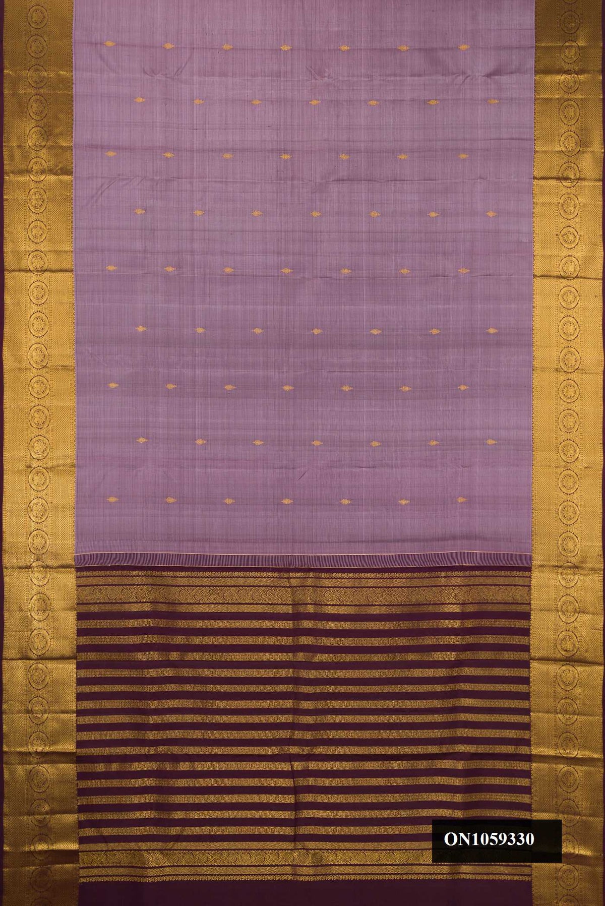 Lavender Dual Tone Kanchipuram Silk Saree with Zari Butta on the body and Zari Border.  displayed on a mannequin