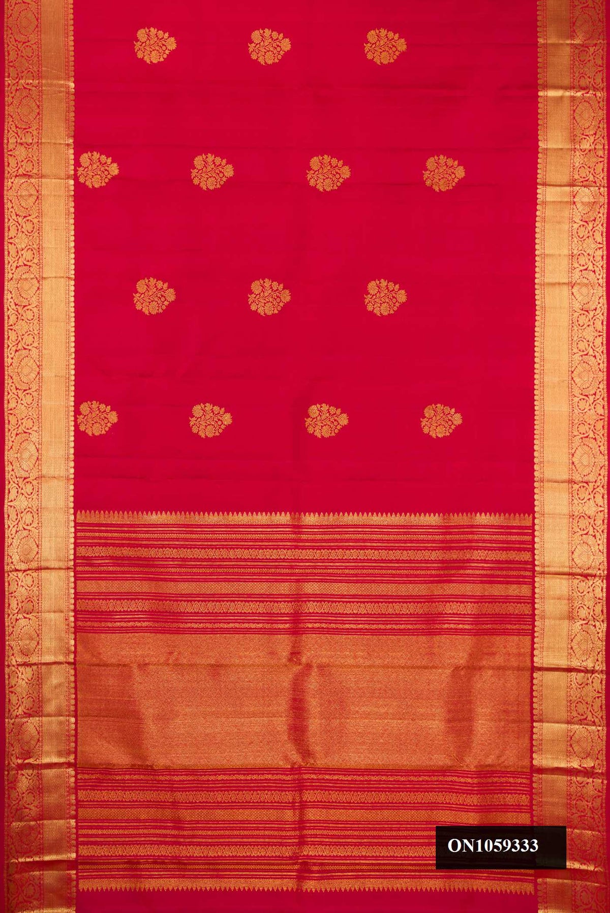 Maroon Dual Tone Kanchipuram Silk Saree with Zari Butta on the body and Zari Border.  displayed on a mannequin