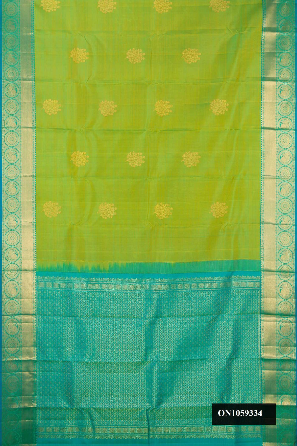 Parrot Green Dual Tone Kanchipuram Silk Saree with Zari Butta on the body and Zari Border.  displayed on a mannequin