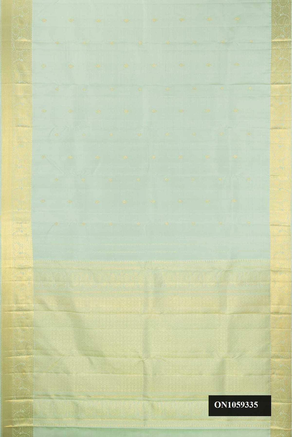 Pista Green Dual Tone Kanchipuram Silk Saree with Zari Butta on the body and Zari Border.  displayed on a mannequin