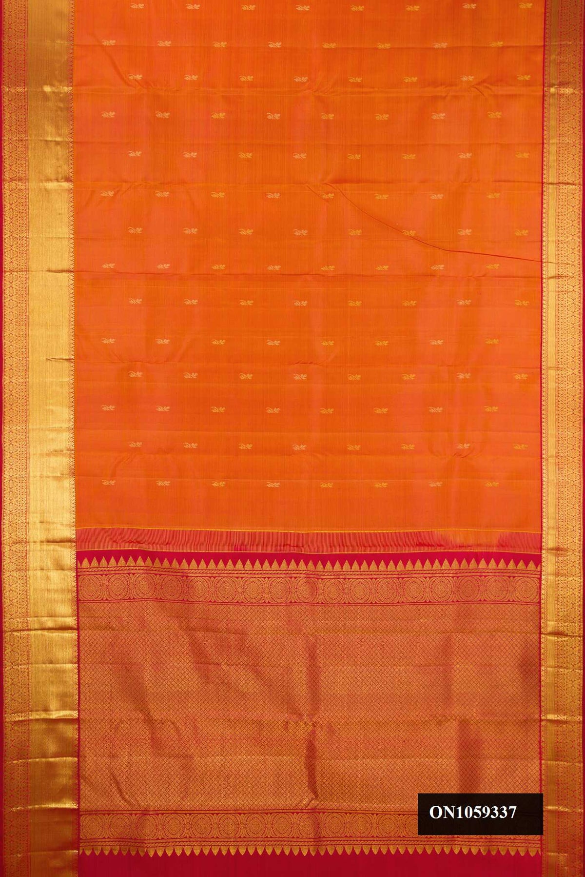Orange Dual Tone Kanchipuram Silk Saree with Zari Butta on the body and Zari Border.  displayed on a mannequin