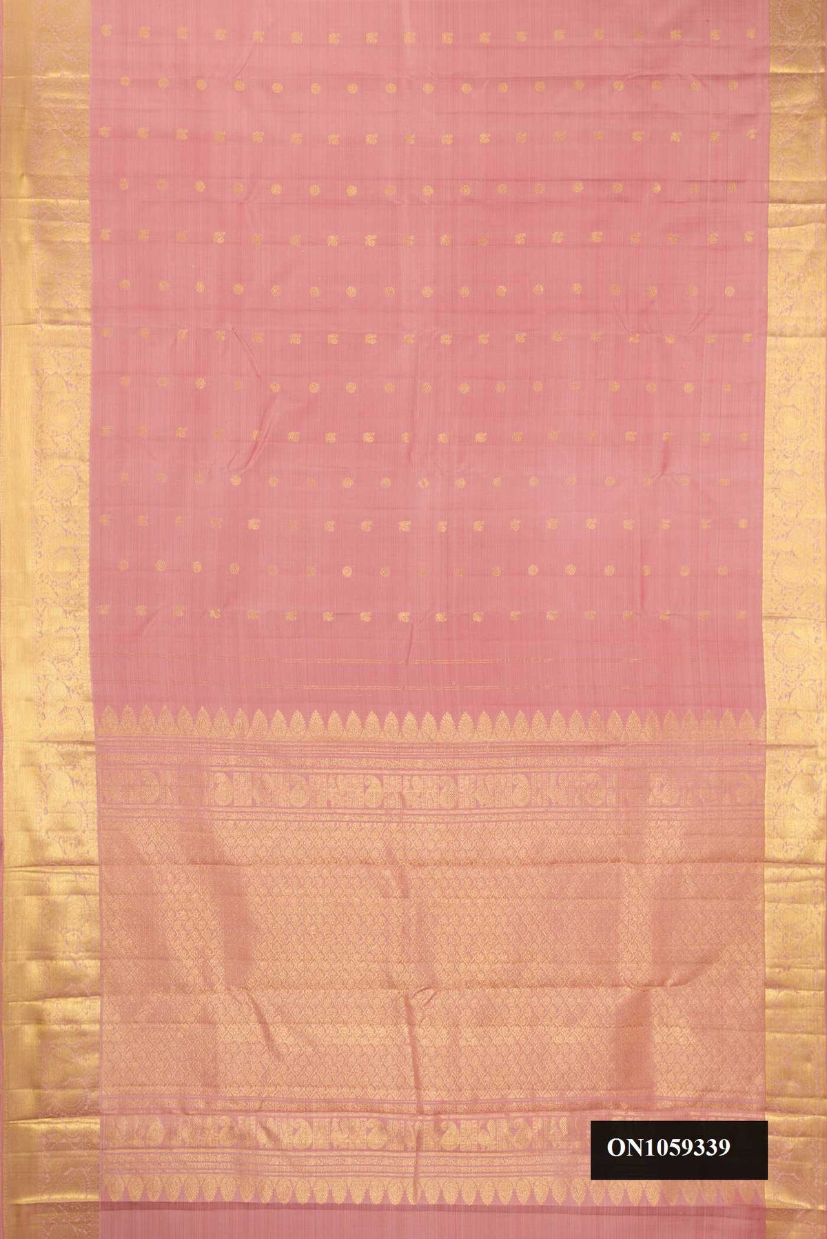 Rose Gold Dual Tone Kanchipuram Silk Saree with Zari Butta on the body and Zari Border.  displayed on a mannequin
