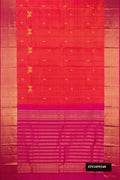 Coral Dual Tone Kanchipuram Silk Saree with Zari Butta on the body and Zari Border.  displayed on a mannequin