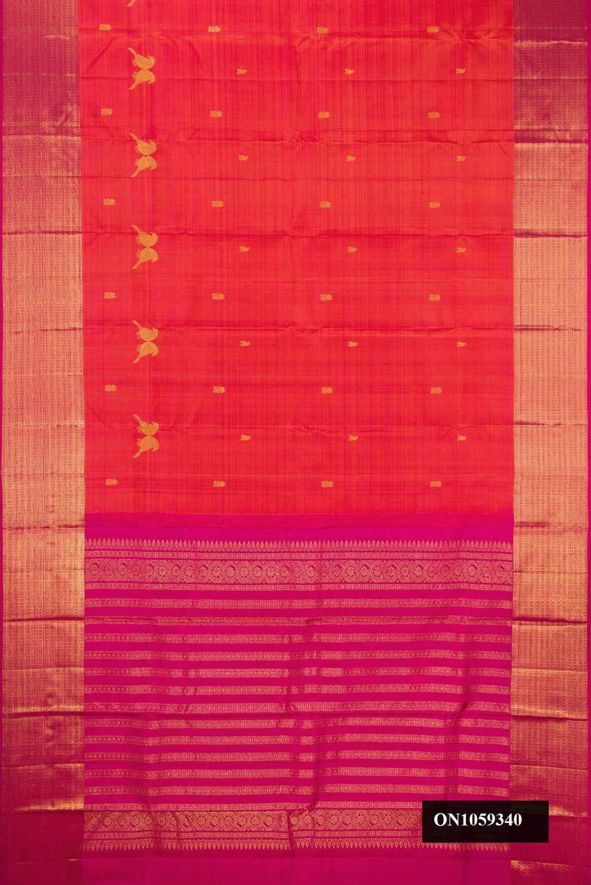 Coral Dual Tone Kanchipuram Silk Saree with Zari Butta on the body and Zari Border.  displayed on a mannequin