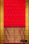 Orange Dual Tone Kanchipuram Silk Saree with Zari Butta on the body and Zari Border.  displayed on a mannequin