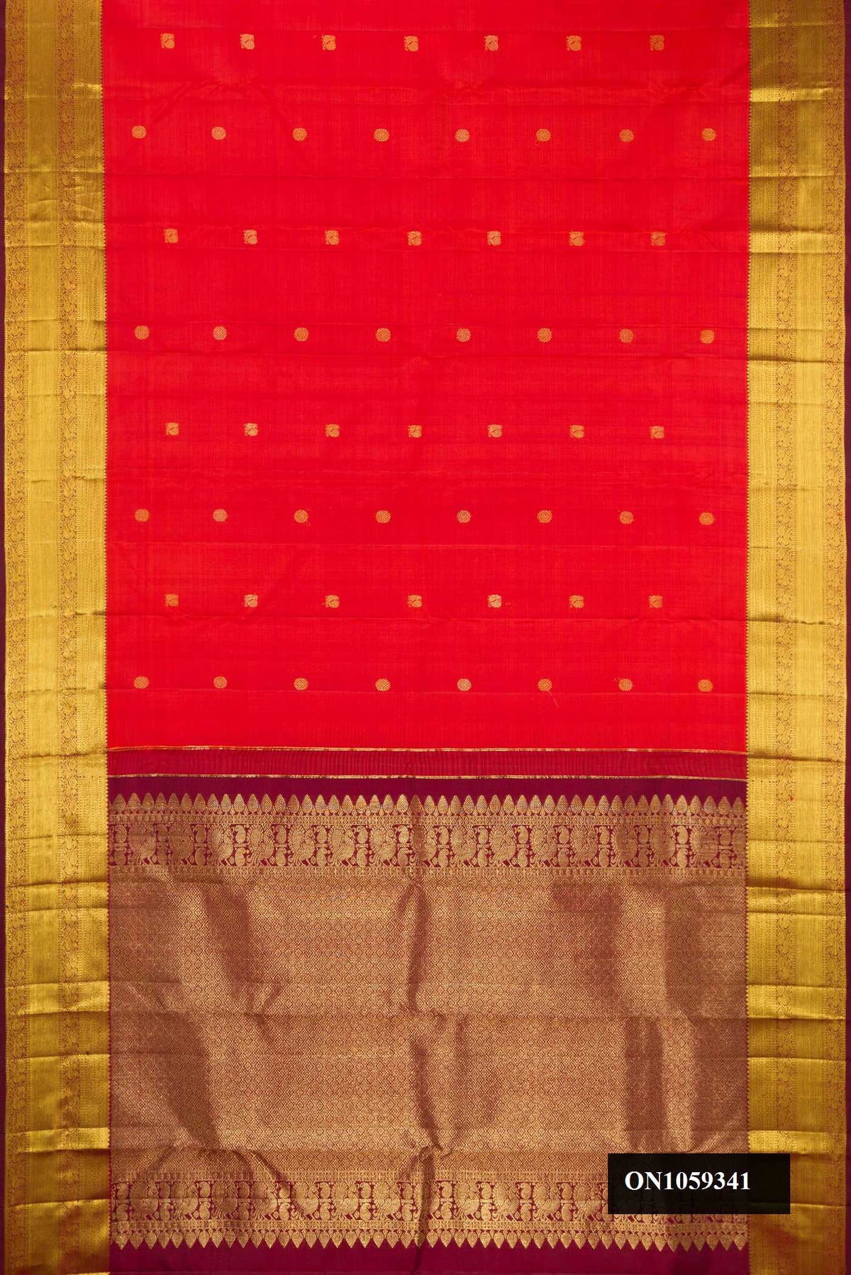 Orange Dual Tone Kanchipuram Silk Saree with Zari Butta on the body and Zari Border.  displayed on a mannequin