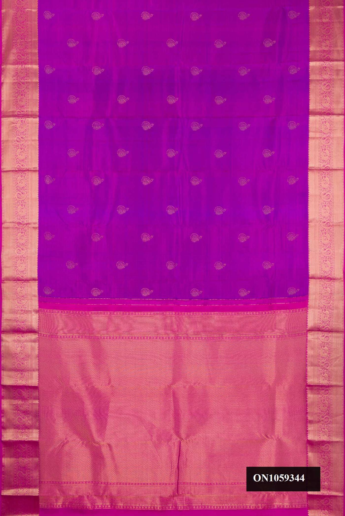 Purple Dual Tone Kanchipuram Silk Saree with Zari Butta on the body and Zari Border.  displayed on a mannequin