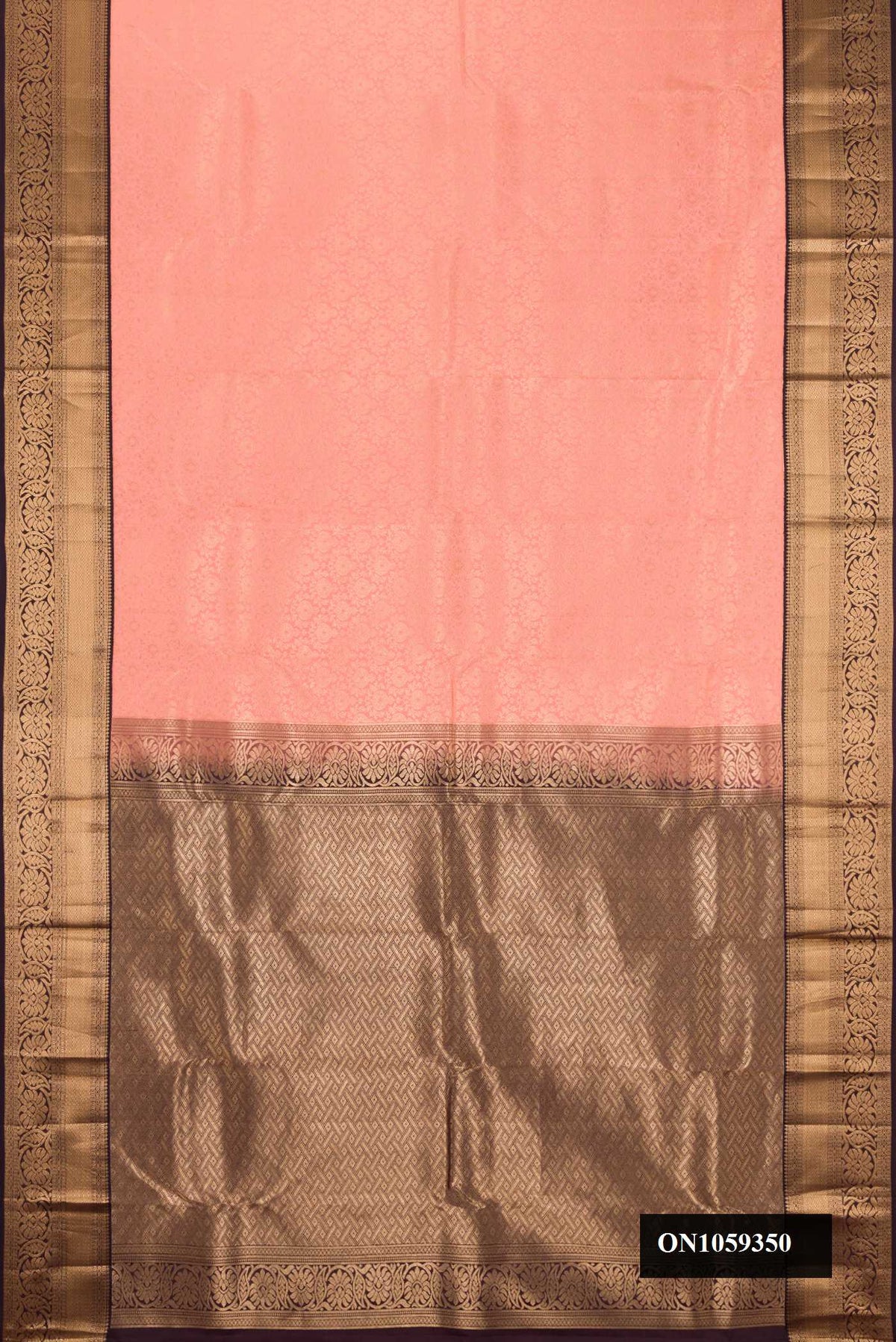 Peach Dual Tone Kanchipuram Silk Saree with Zari Brocade on the body and Zari Border.  displayed on a mannequin