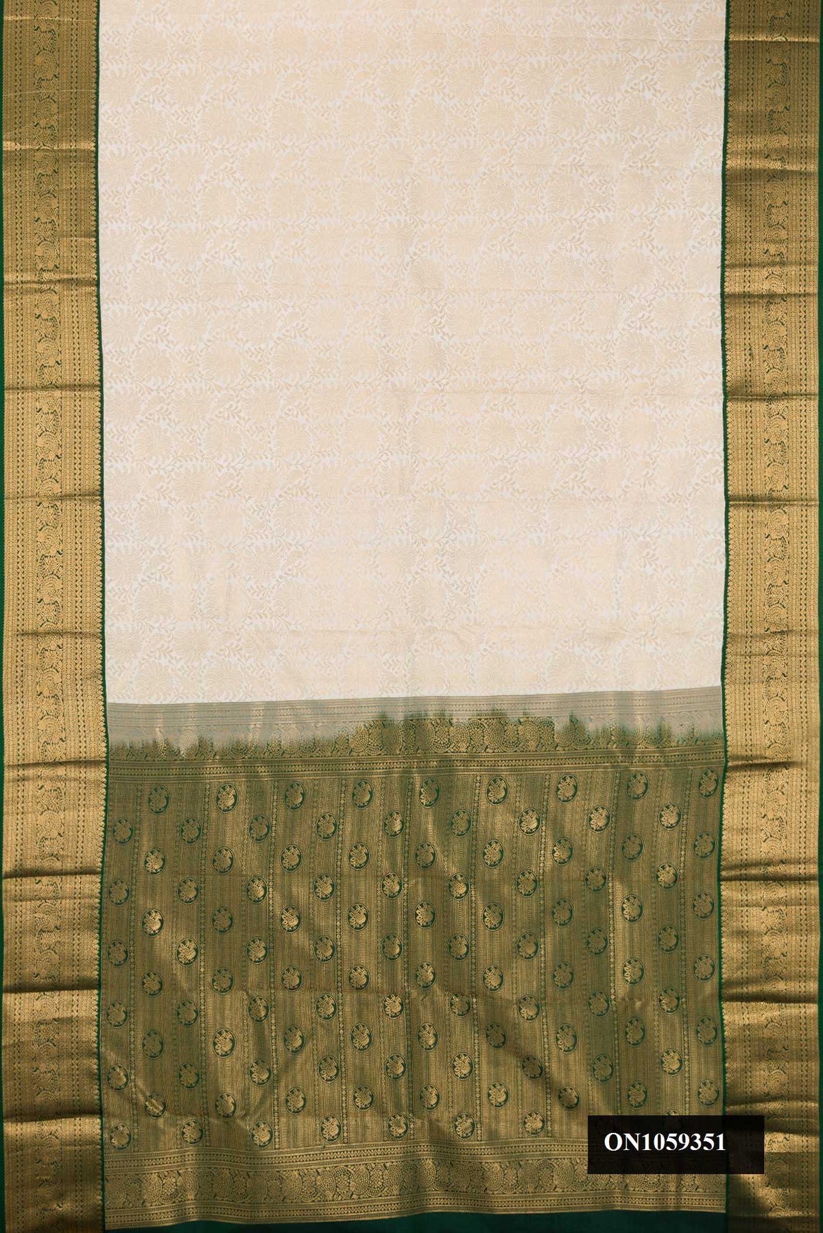 Off White Dual Tone Kanchipuram Silk Saree with Zari Brocade on the body and Zari Border.  displayed on a mannequin