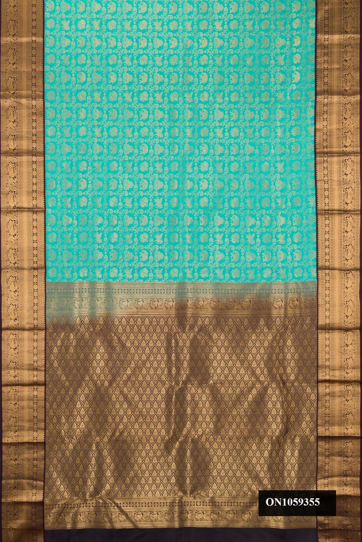 Sky Blue Dual Tone Kanchipuram Silk Saree with Zari Brocade on the body and Zari Border.  displayed on a mannequin