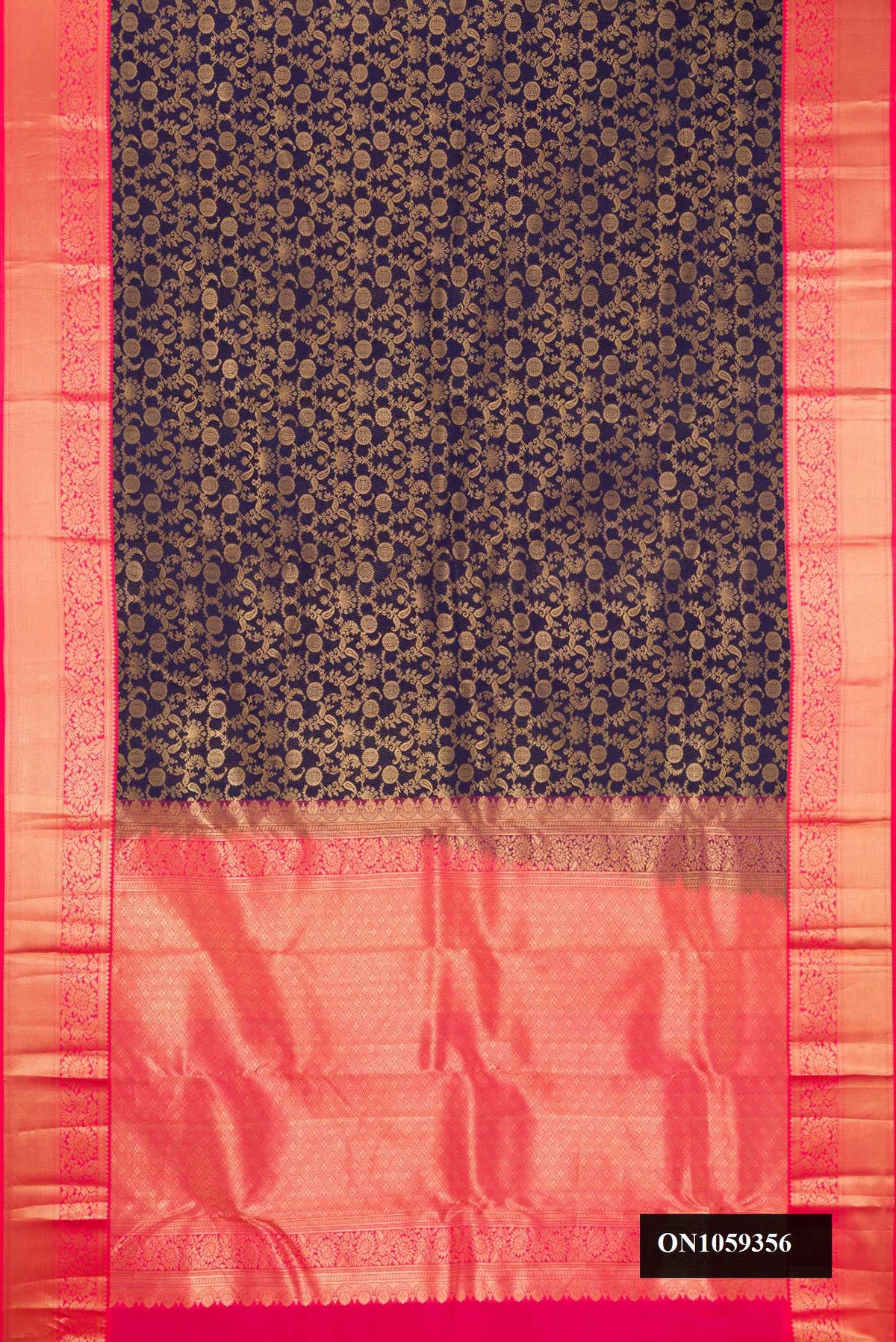 Navy Blue Dual Tone Kanchipuram Silk Saree with Zari Brocade on the body and Zari Border.  displayed on a mannequin