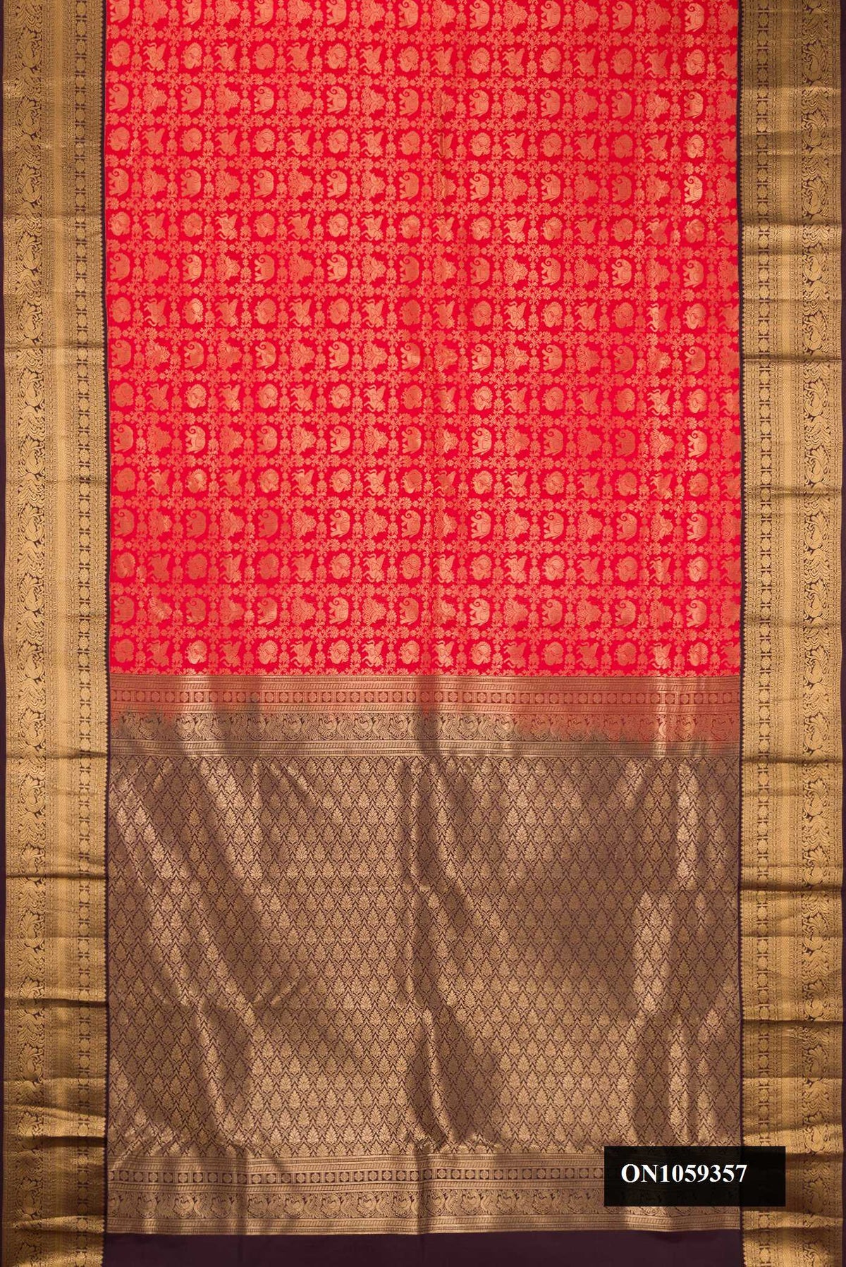 Red Dual Tone Kanchipuram Silk Saree with Zari Brocade on the body and Zari Border.  displayed on a mannequin