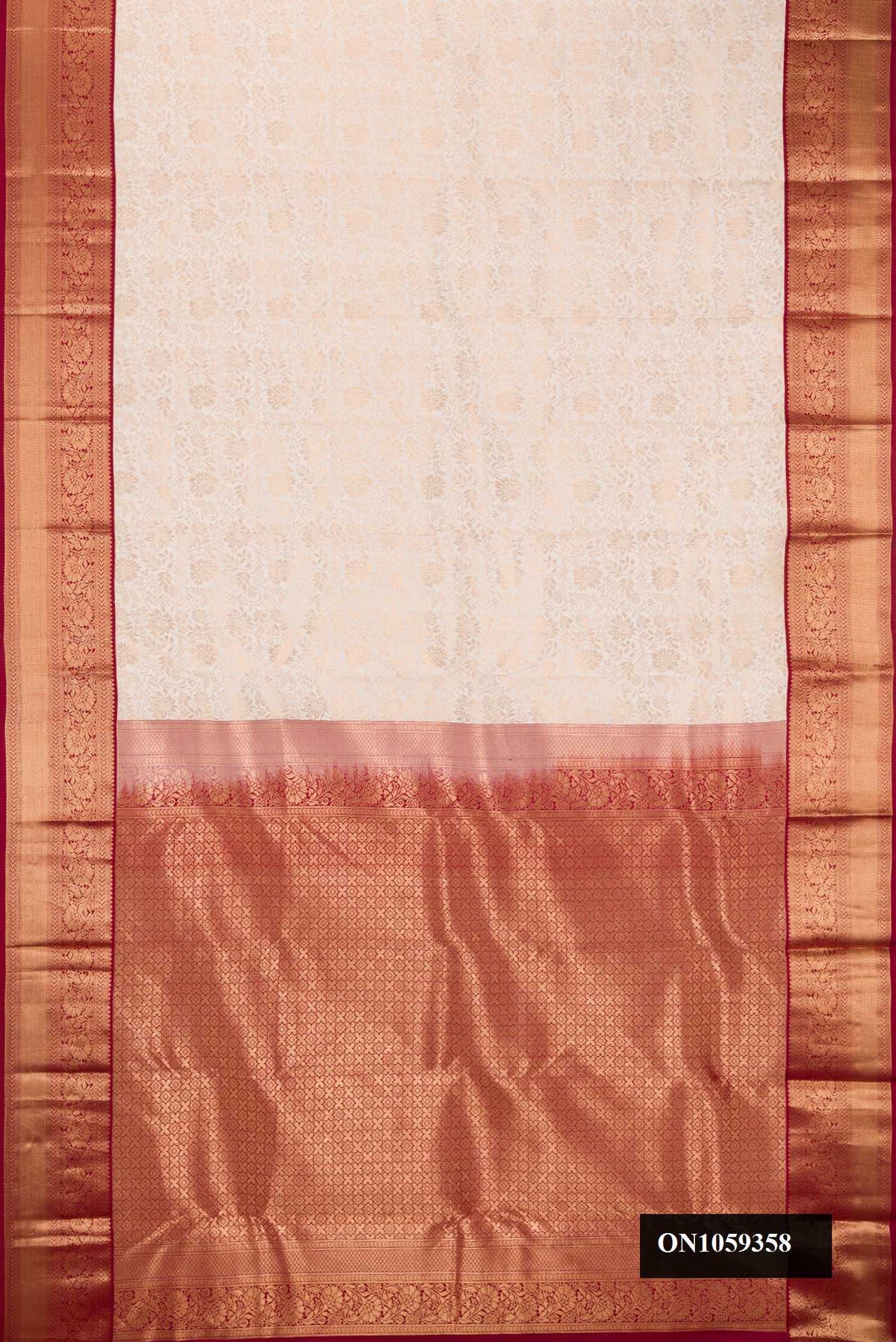 Off White Dual Tone Kanchipuram Silk Saree with Zari Brocade on the body and Zari Border.  displayed on a mannequin
