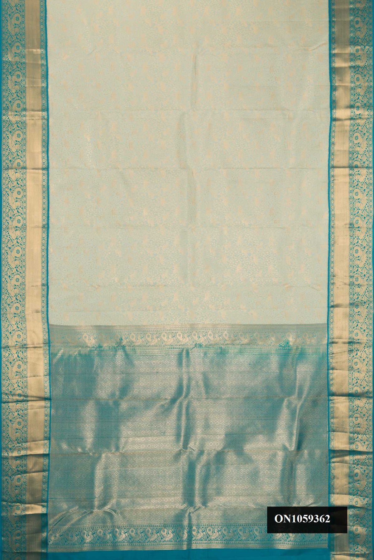 Beige Dual Tone Kanchipuram Silk Saree with Zari Brocade on the body and Zari Border.  displayed on a mannequin