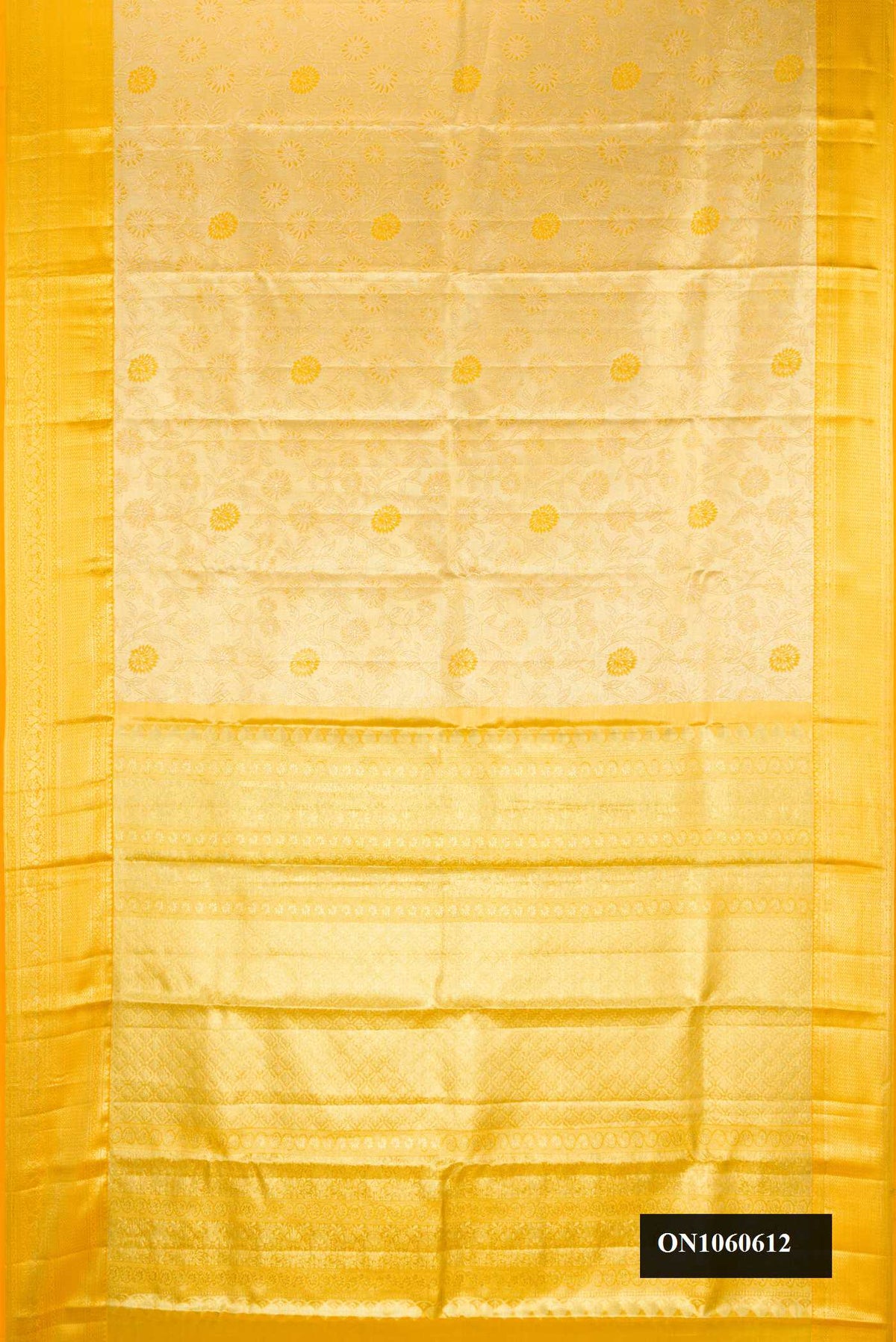 Gold Dual Tone Kanchipuram Tissue Silk Saree with Zari Brocade on the body and Zari Border.  displayed on a mannequin