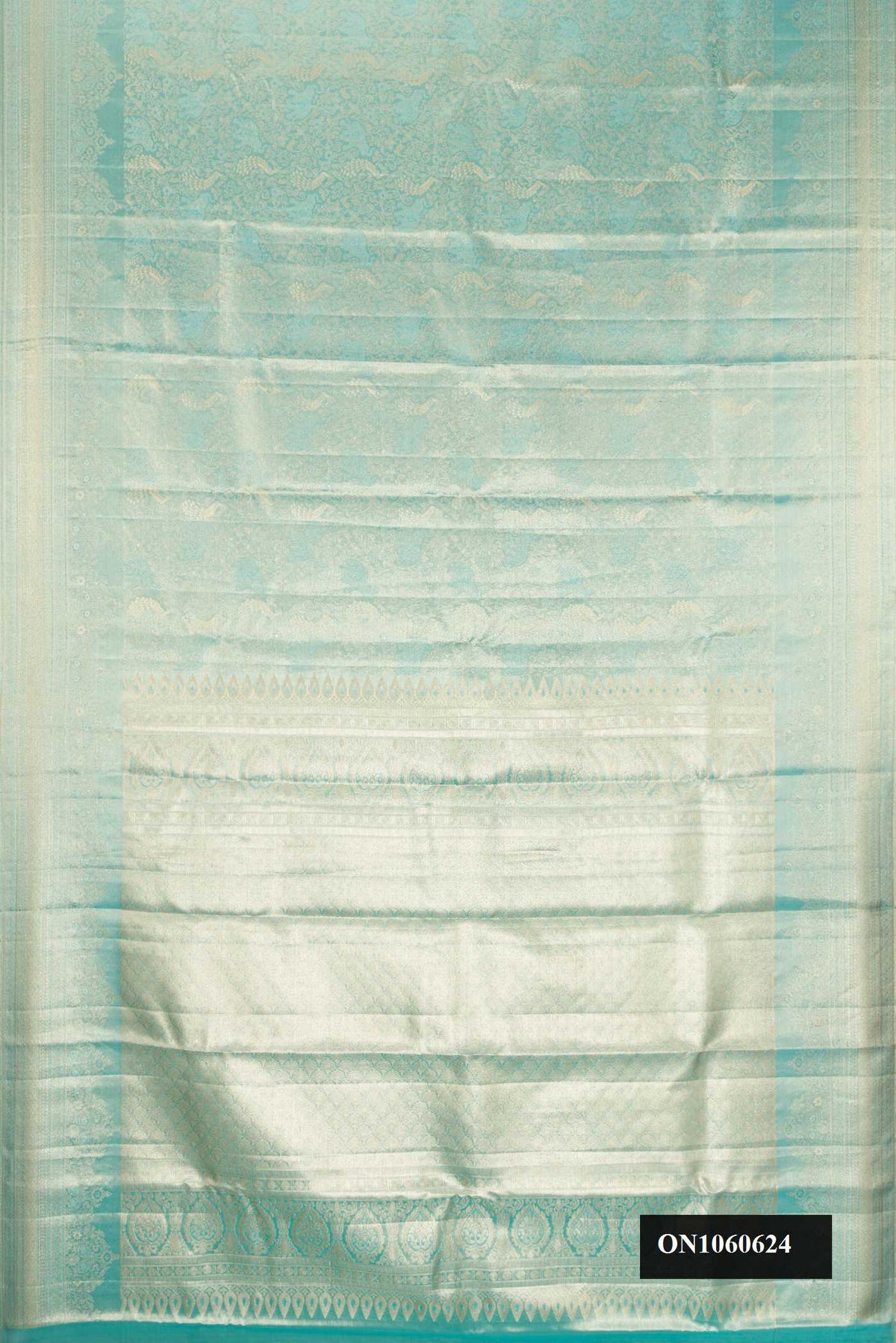 Light Blue Dual Tone Kanchipuram Tissue Silk Saree with Zari Brocade on the body and Zari Border.  displayed on a mannequin