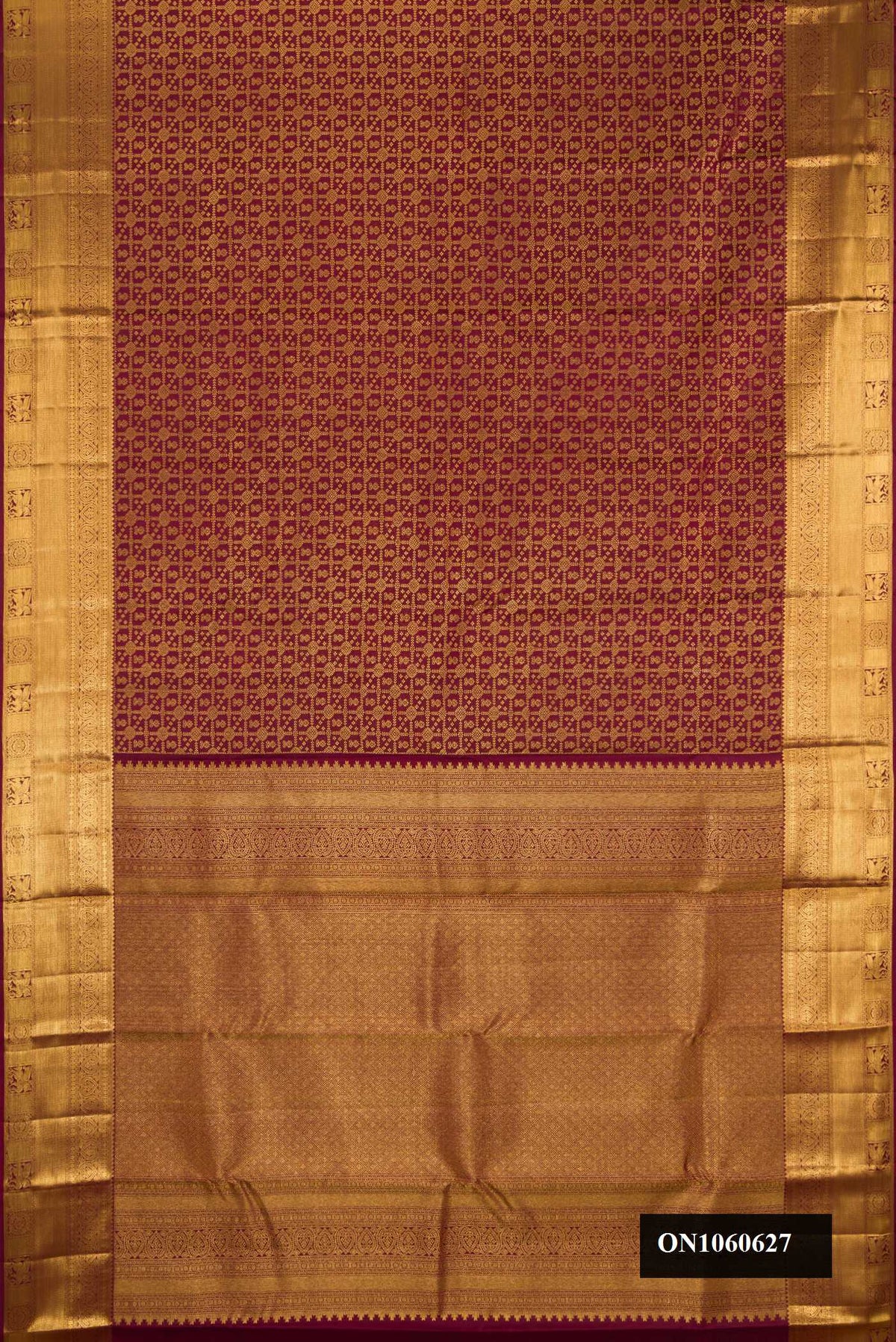 Maroon Dual Tone Kanchipuram Silk Saree with Zari Brocade on the body and Zari Border.  displayed on a mannequin
