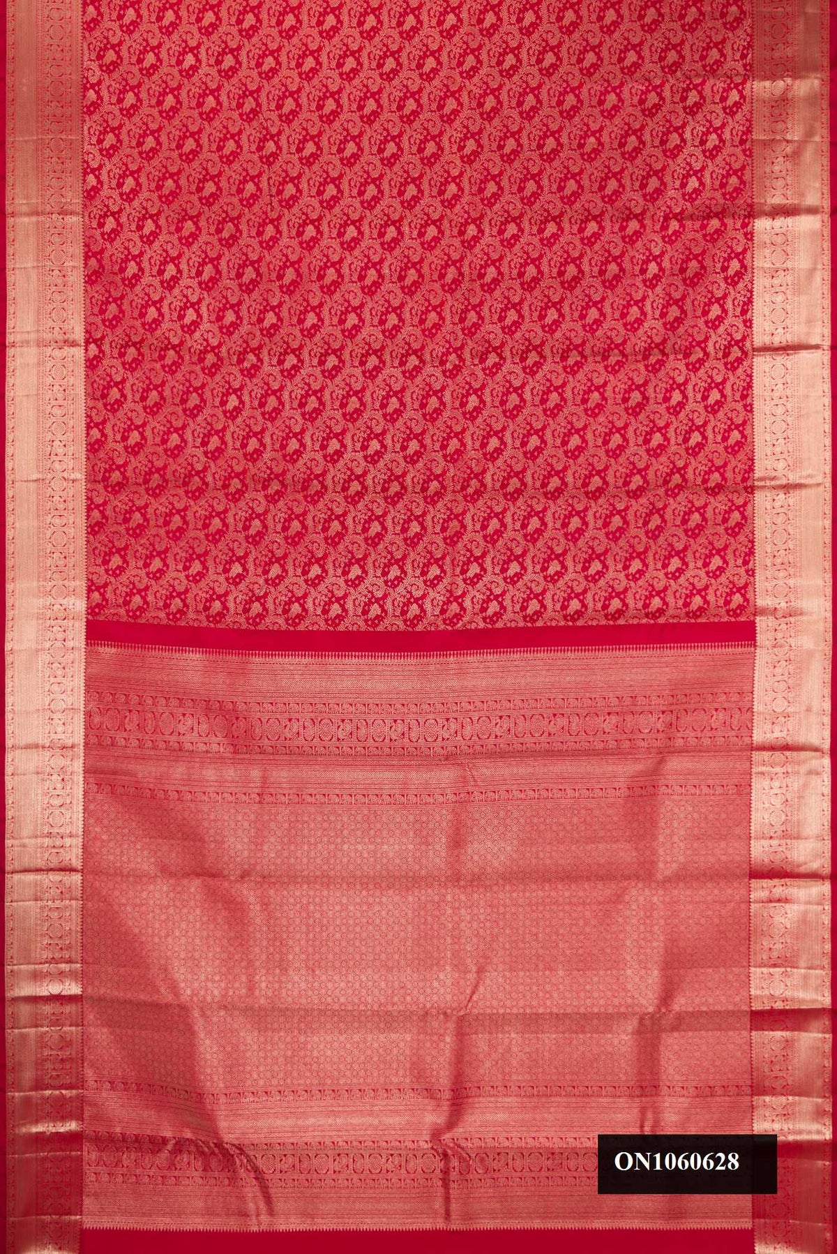 Red Dual Tone Kanchipuram Silk Saree with Zari Brocade on the body and Zari Border.  displayed on a mannequin