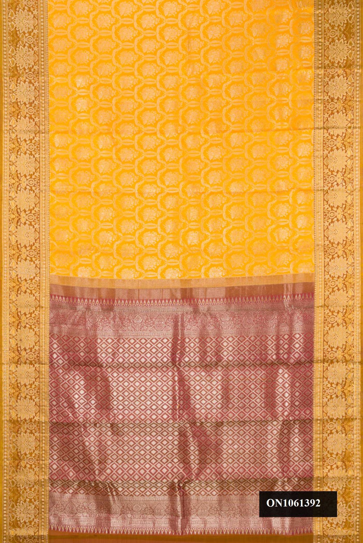 Mustard Dual Tone Kanchipuram Silk Saree with Zari Brocade on the body and Fancy Border.  displayed on a mannequin