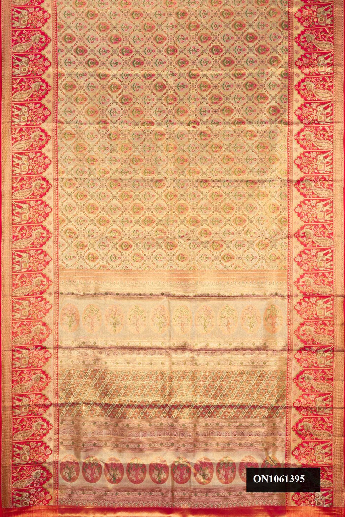 Gold Dual Tone Kanchipuram Tissue Silk Saree with Zari Brocade on the body and Zari Border.  displayed on a mannequin