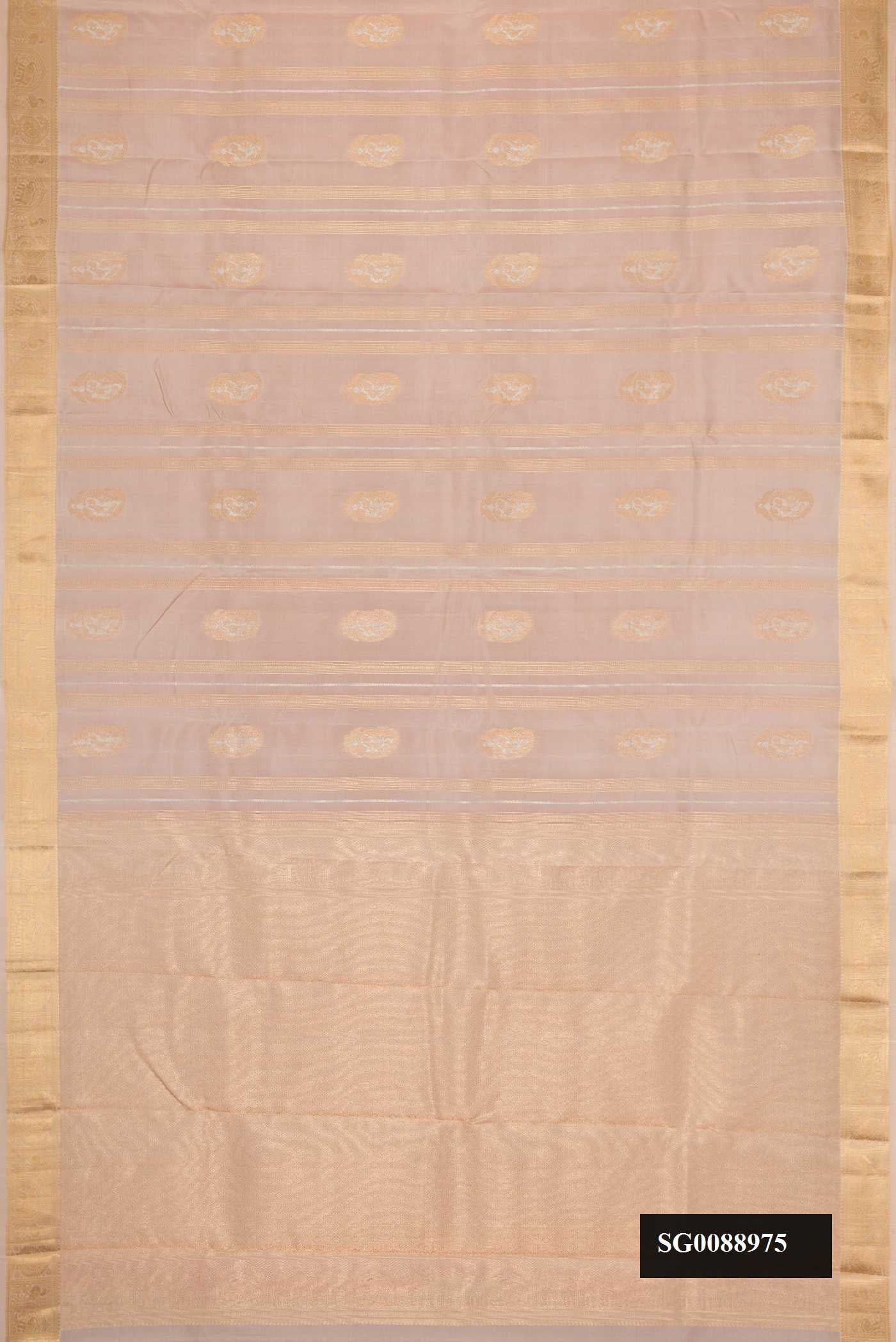 Rose Gold Dual Tone Kanchipuram Silk Saree with Zari Butta on the body and Zari Border.  displayed on a mannequin