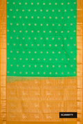 Green Dual Tone Kanchipuram Silk Saree with Zari Butta on the body and Zari Border.  displayed on a mannequin