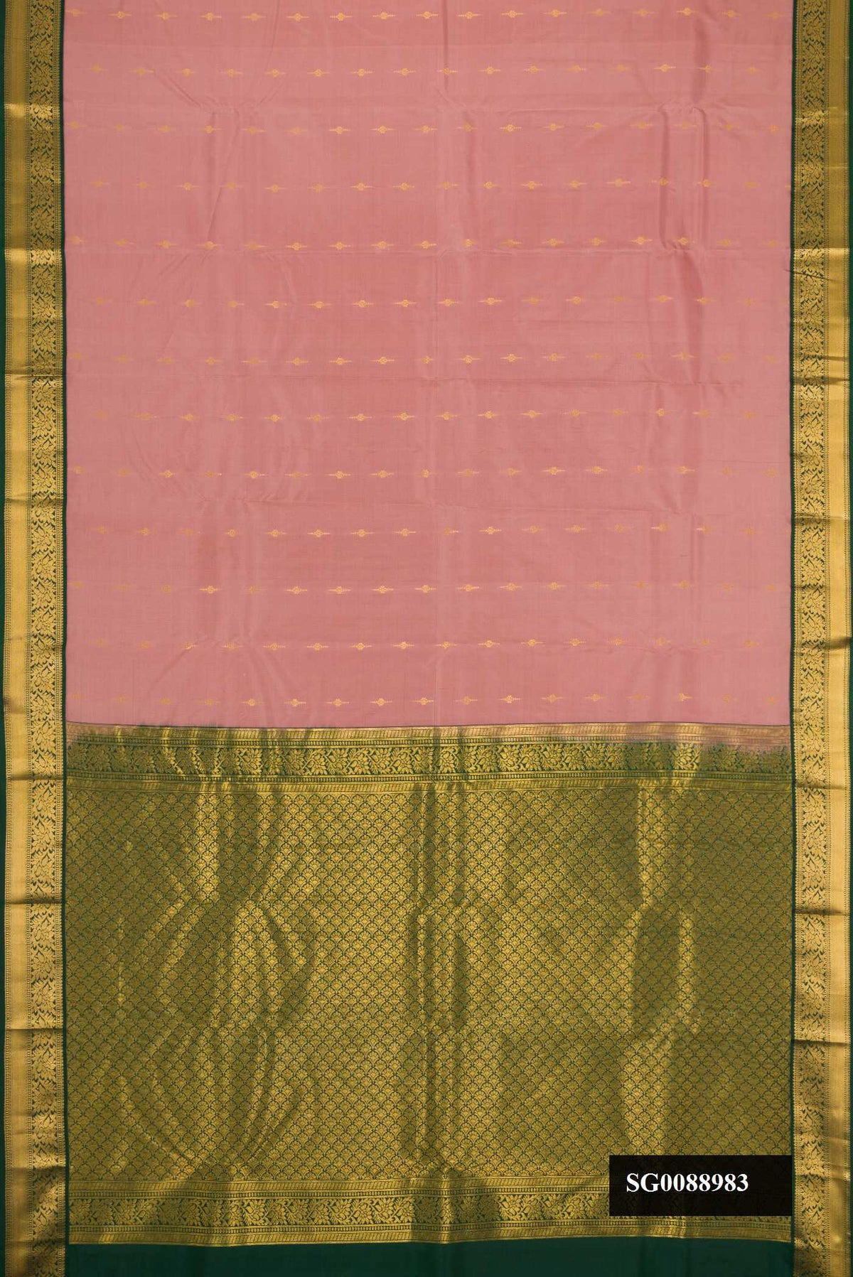 Rose Gold Dual Tone Kanchipuram Silk Saree with Zari Butta on the body and Zari Border.  displayed on a mannequin