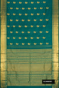Green Dual Tone Kanchipuram Silk Saree with Zari Butta on the body and Zari Border.  displayed on a mannequin