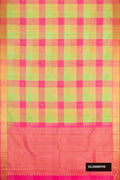 Green Dual Tone Kanchipuram Silk Saree with Checked design on the body and Zari Border.  displayed on a mannequin