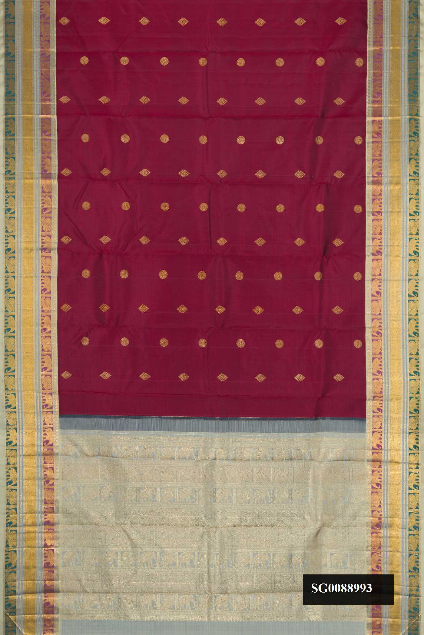 Maroon Dual Tone Kanchipuram Silk Saree with Zari Butta on the body and Zari Border.  displayed on a mannequin