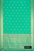 Light Green Dual Tone Kanchipuram Silk Saree with Zari Butta on the body and Zari Border.  displayed on a mannequin