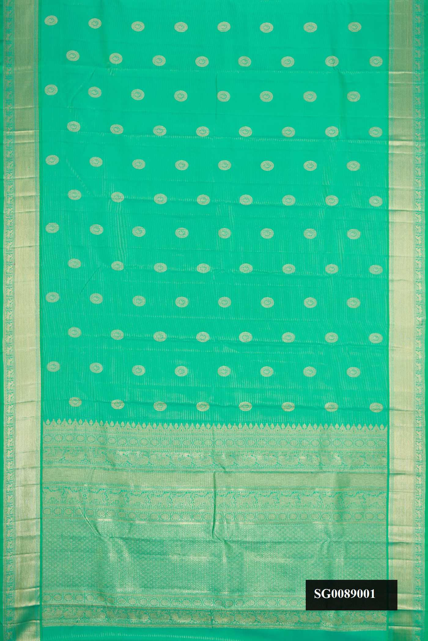 Light Green Dual Tone Kanchipuram Silk Saree with Zari Butta on the body and Zari Border.  displayed on a mannequin