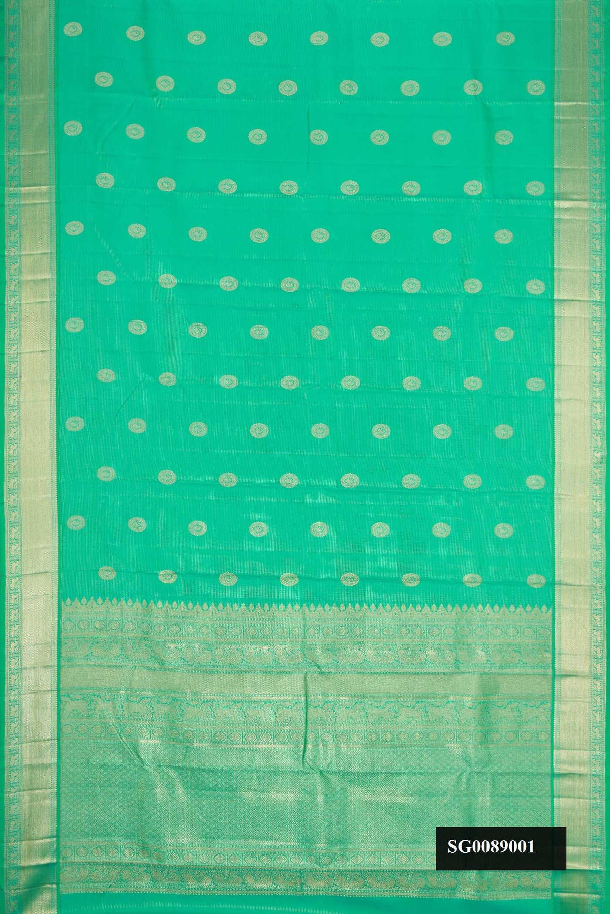 Light Green Dual Tone Kanchipuram Silk Saree with Zari Butta on the body and Zari Border.  displayed on a mannequin