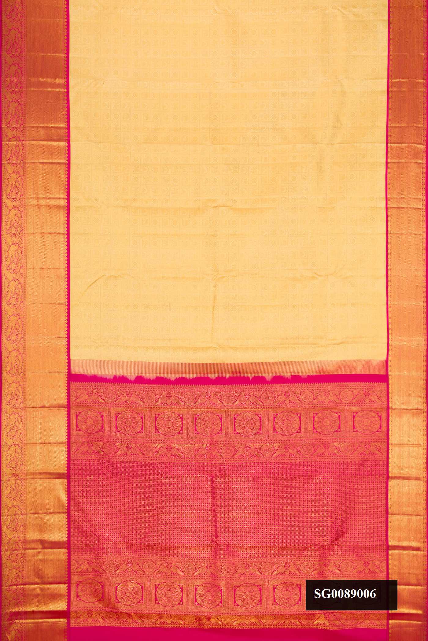 Gold Dual Tone Kanchipuram Silk Saree with Zari Brocade on the body and Zari Border.  displayed on a mannequin