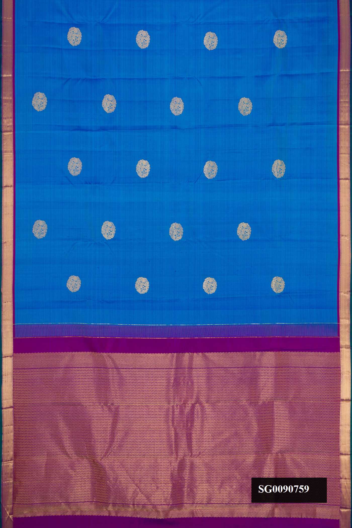 Sky Blue Kanchipuram Silk Saree with Zari Butta on the body and Zari Border.  displayed on a mannequin
