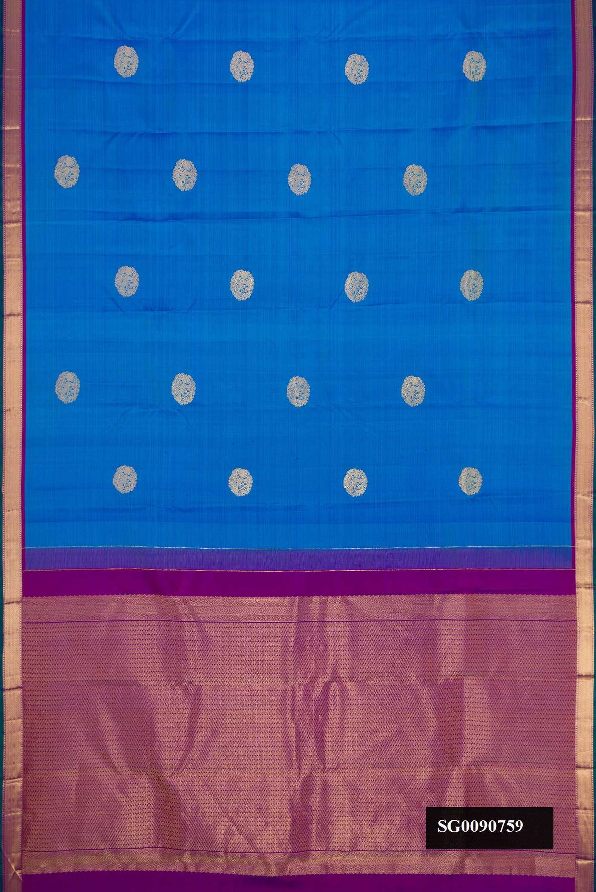 Sky Blue Kanchipuram Silk Saree with Zari Butta on the body and Zari Border.  displayed on a mannequin