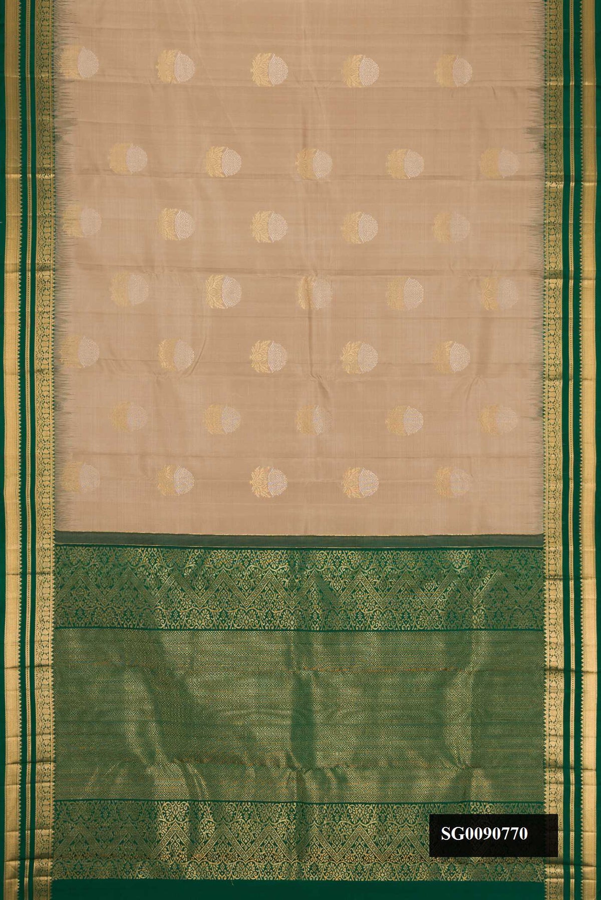Beige Dual Tone Kanchipuram Silk Saree with Zari Butta on the body and Zari Border.  displayed on a mannequin