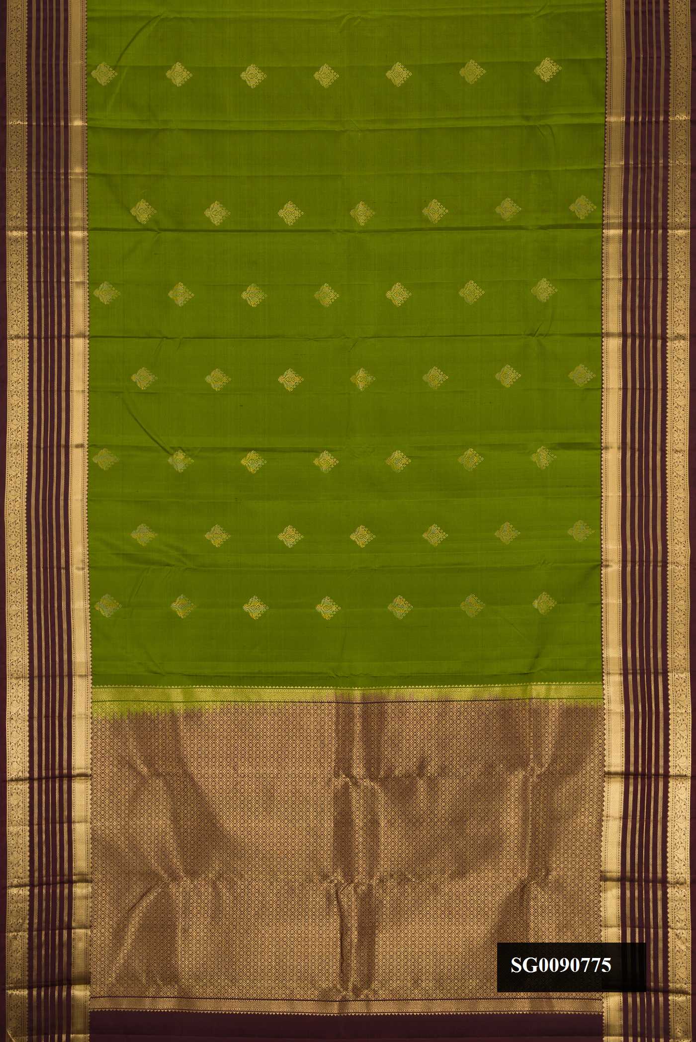 Green Dual Tone Kanchipuram Silk Saree with Zari Butta on the body and Zari Border.  displayed on a mannequin