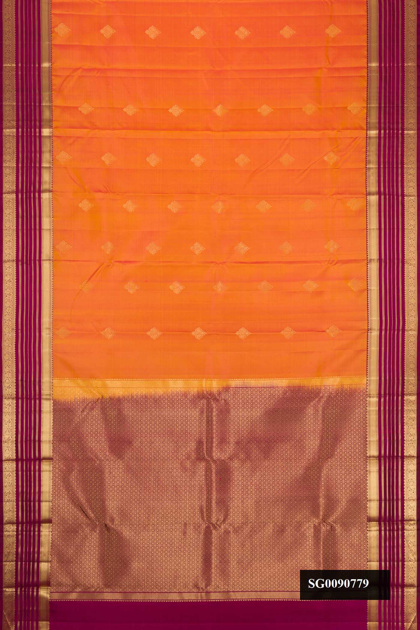 Brick Orange Dual Tone Kanchipuram Silk Saree with Zari Butta on the body and Zari Border.  displayed on a mannequin