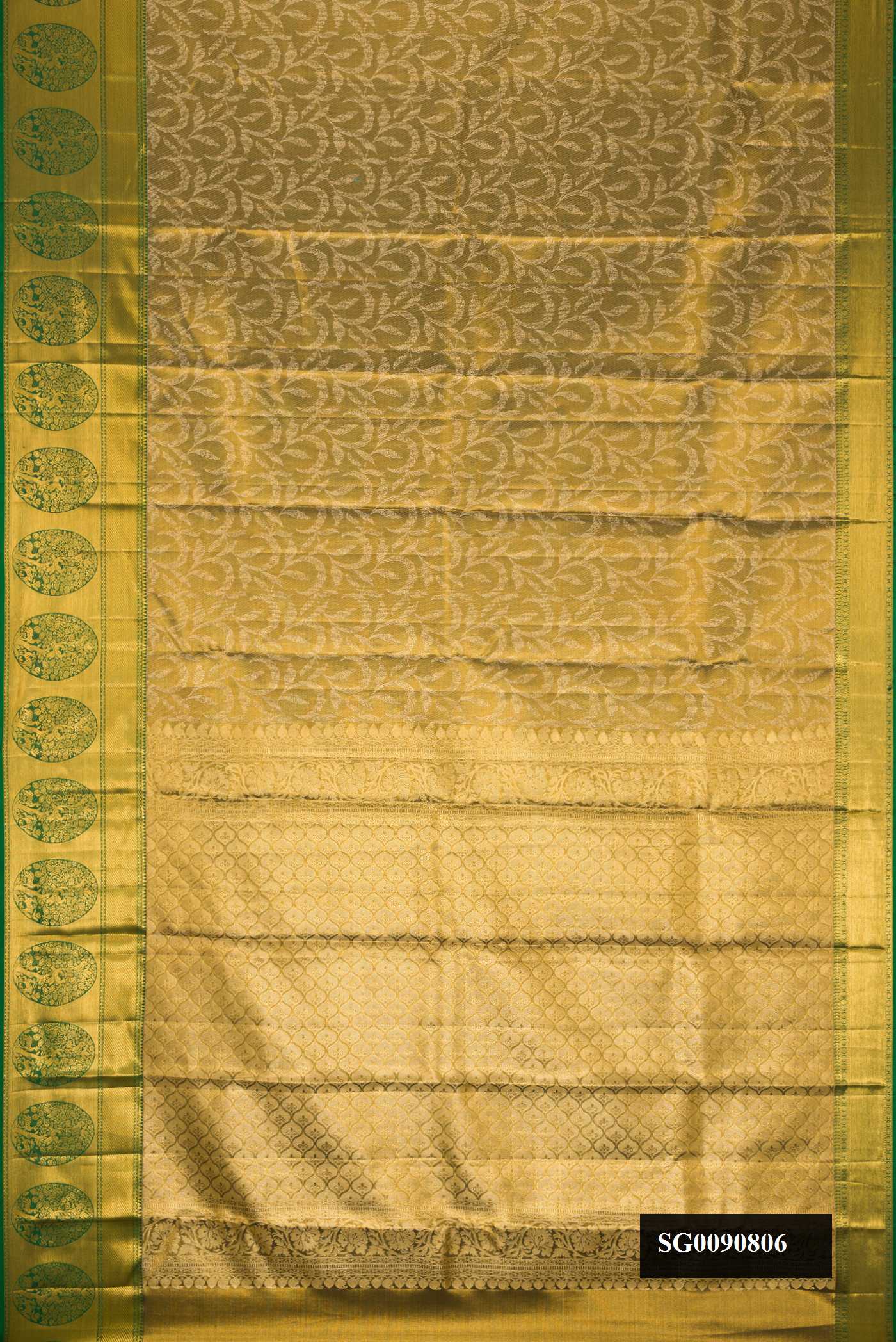 Mehandi Green Dual Tone Kanchipuram Tissue Silk Saree with Zari Brocade on the body and Zari Border.  displayed on a mannequin