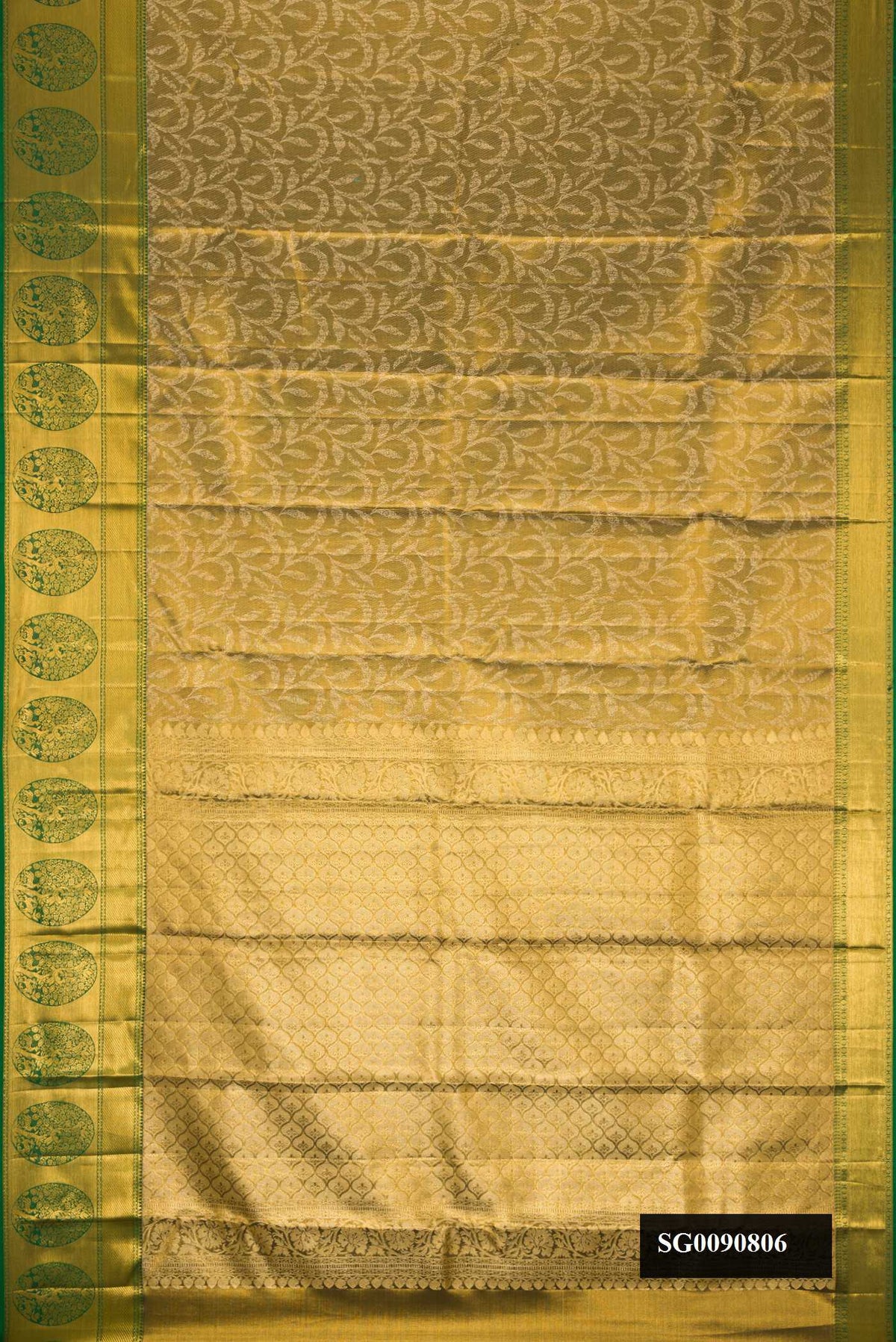 Mehandi Green Dual Tone Kanchipuram Tissue Silk Saree with Zari Brocade on the body and Zari Border.  displayed on a mannequin