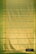 Green Dual Tone Kanchipuram Tissue Silk Saree with Zari Brocade on the body and Zari Border.  displayed on a mannequin