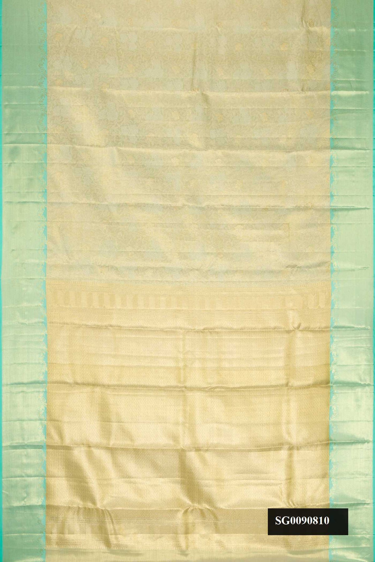 Light Green Dual Tone Kanchipuram Tissue Silk Saree with Zari Brocade on the body and Zari Border.  displayed on a mannequin