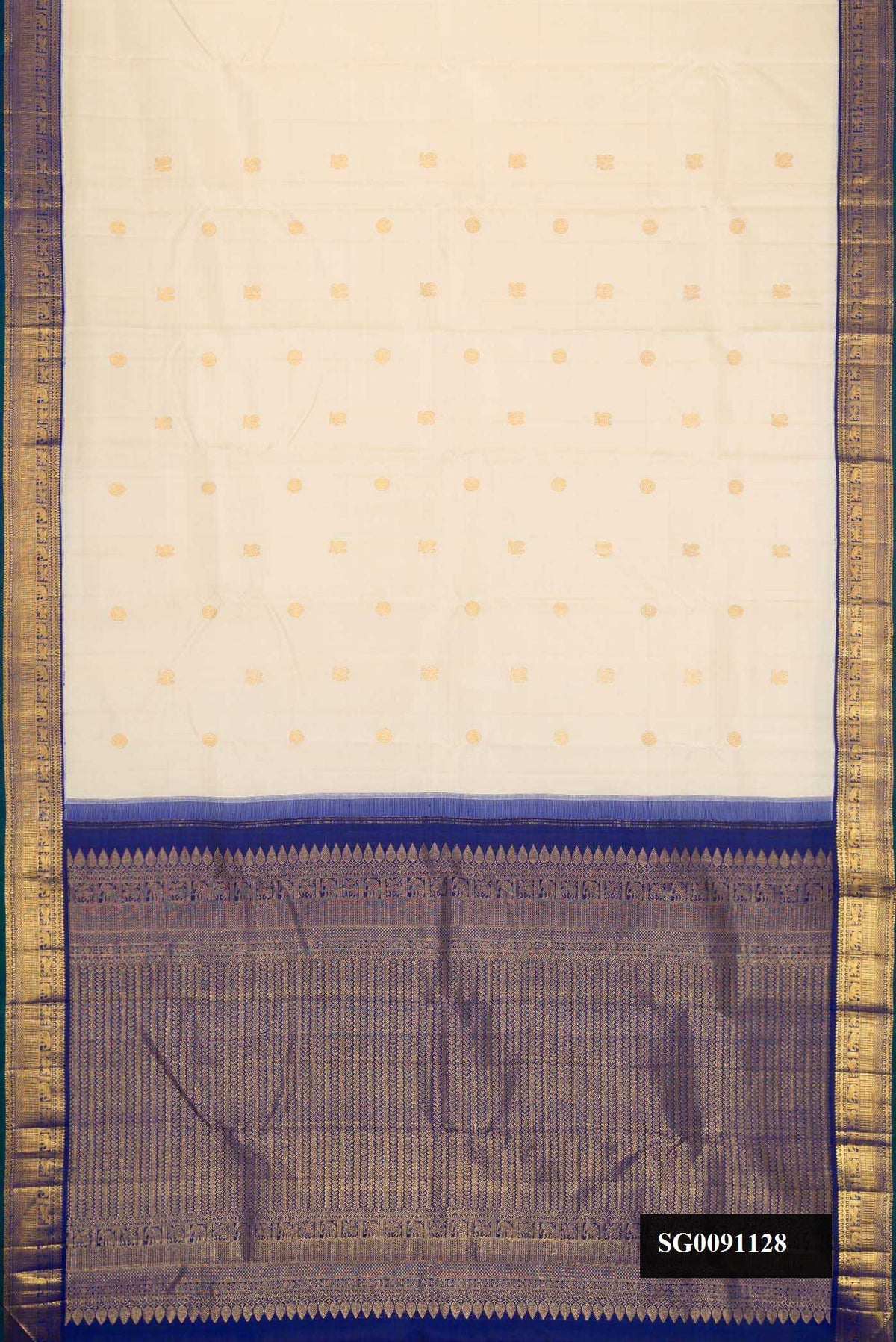 Sandal Dual Tone Kanchipuram Silk Saree with Zari Butta on the body and Zari Border.  displayed on a mannequin