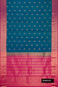 Peacock Blue Dual Tone Kanchipuram Silk Saree with Zari Butta on the body and Zari Border.  displayed on a mannequin